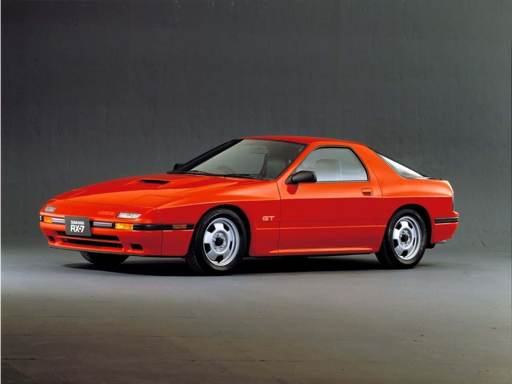 Red Mazda Savanna RX-7 FC classic 80s sports car in studio perfect JDM wallpaper background