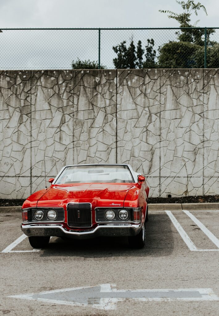 Classic Red Mercury Cougar - Vintage Car Wallpaper with Retro Backdrop