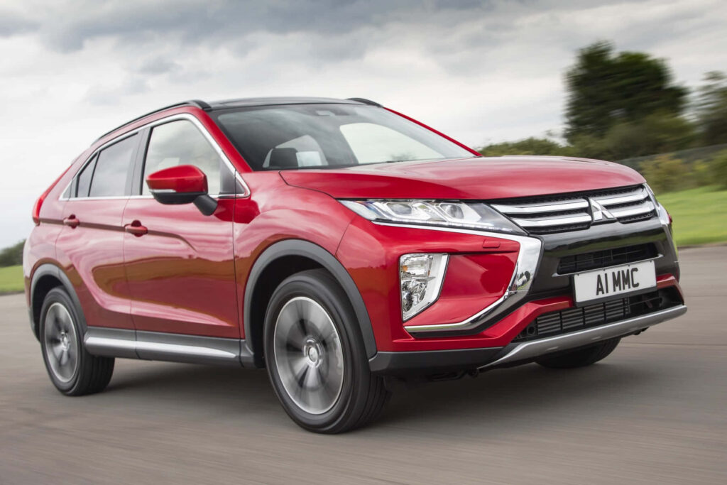 Vibrant Red Mitsubishi Eclipse Cross Wallpaper in Dynamic Setting