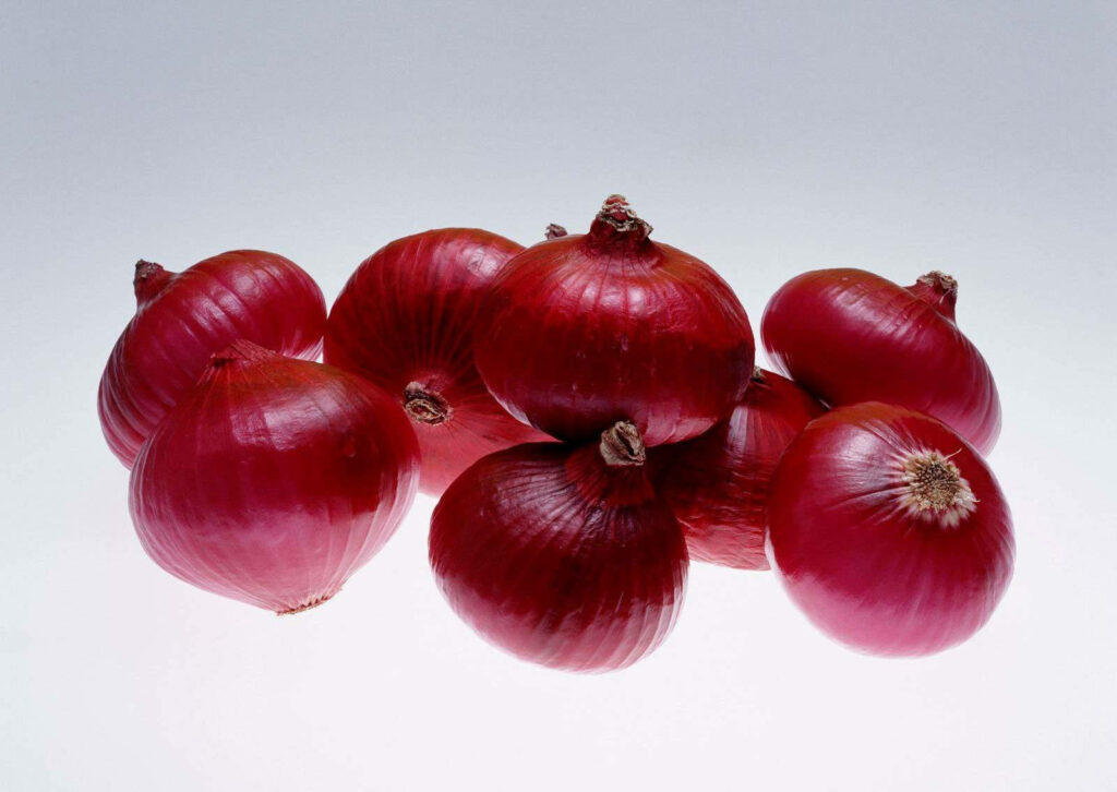 Vibrant Red Onions Wallpaper Background - Fresh & Glossy Design