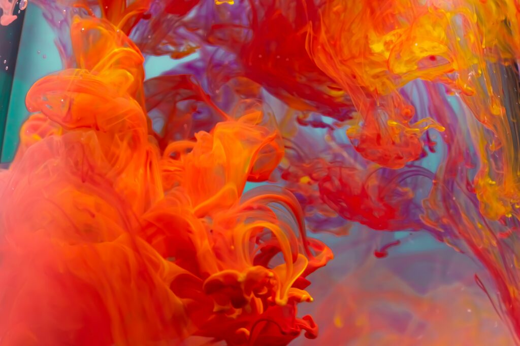 Dynamic Red and Orange Liquid Paint Wallpaper Background
