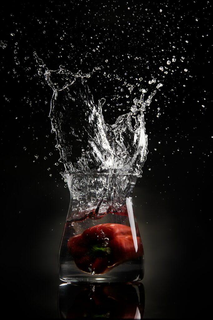 Vibrant Red Pepper Splash Wallpaper – Dark Background Aesthetic