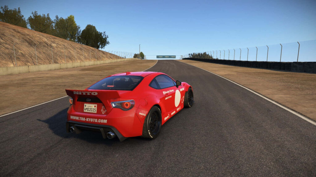 Vibrant red sports car racing on sunlit track in realistic driving game wallpaper background