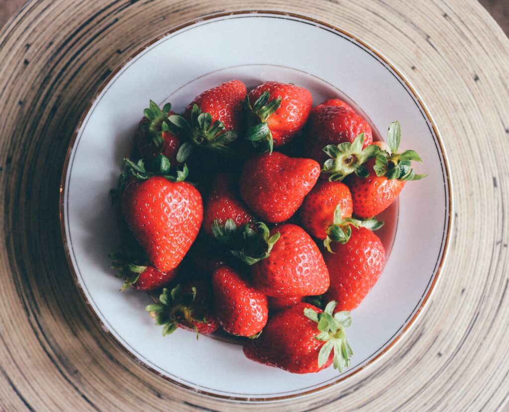 Vibrant Bowl of Fresh Ripe Strawberries - Beautiful Wallpaper Background