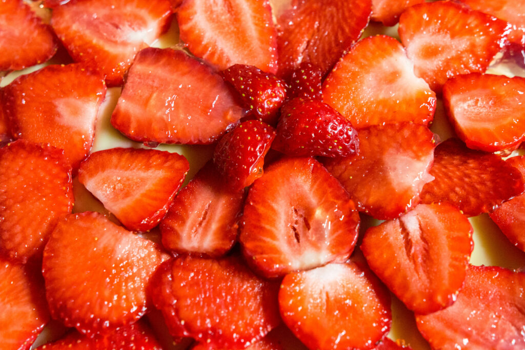 Vibrant Red Strawberry Wallpaper: Fresh & Juicy Sliced Background