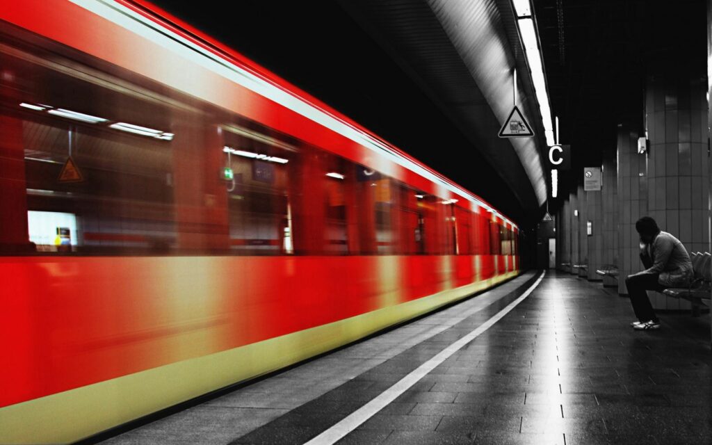 Vibrant Red Subway Train Wallpaper: Evocative Underground Scene