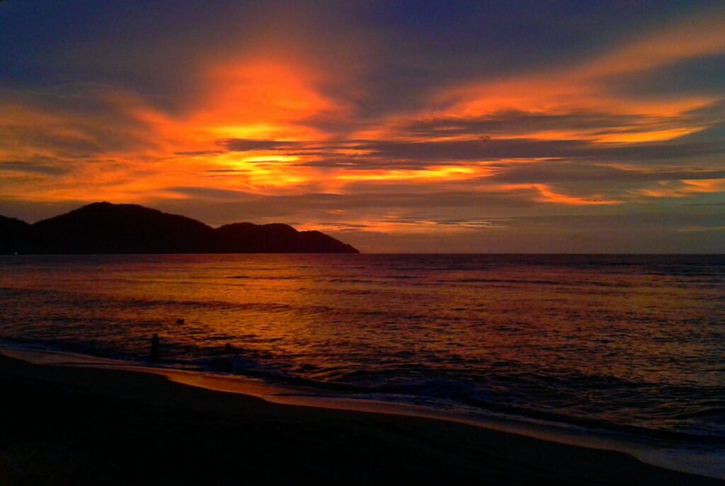 Crimson Horizon: Captivating Penang's Beaches with Majestic Sunsets Wallpaper