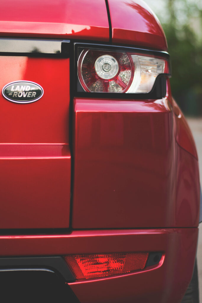 Vibrant Red Tail Light Wallpaper: Land Rover's Modern Design