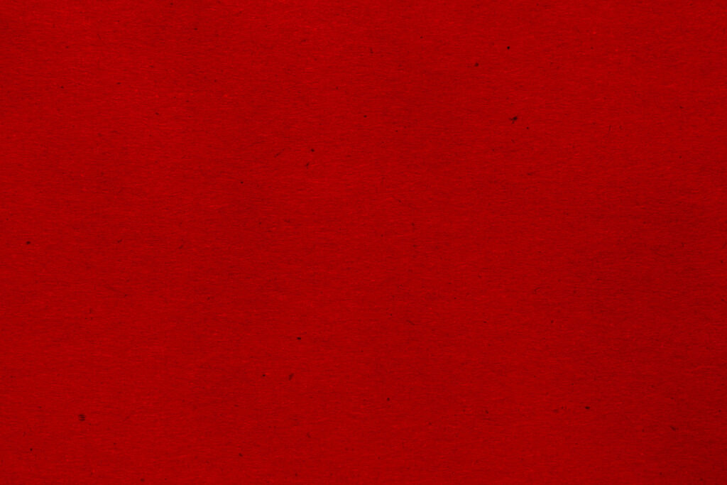 Vibrant Red Textured Craft Paper Wallpaper with Subtle Fibers