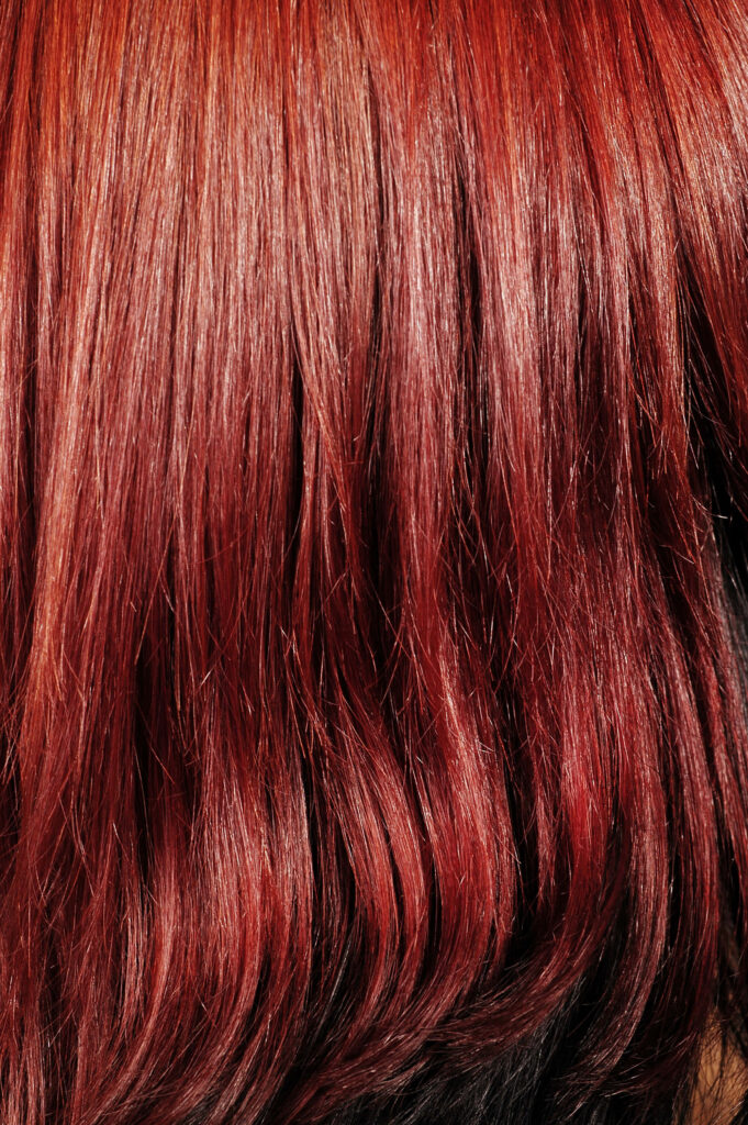 Vibrant Red Textured Hair Close-Up: Glossy & Intricate Wallpaper