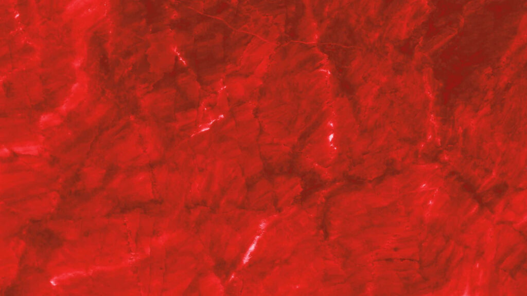 Vibrant Red Textured Wallpaper: Gemstone-Inspired Background