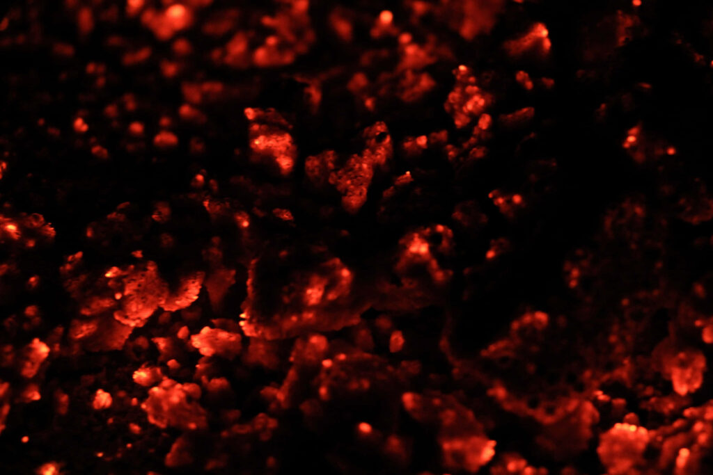 Bright Red Textured Wallpaper: Fiery Ember Glow Background