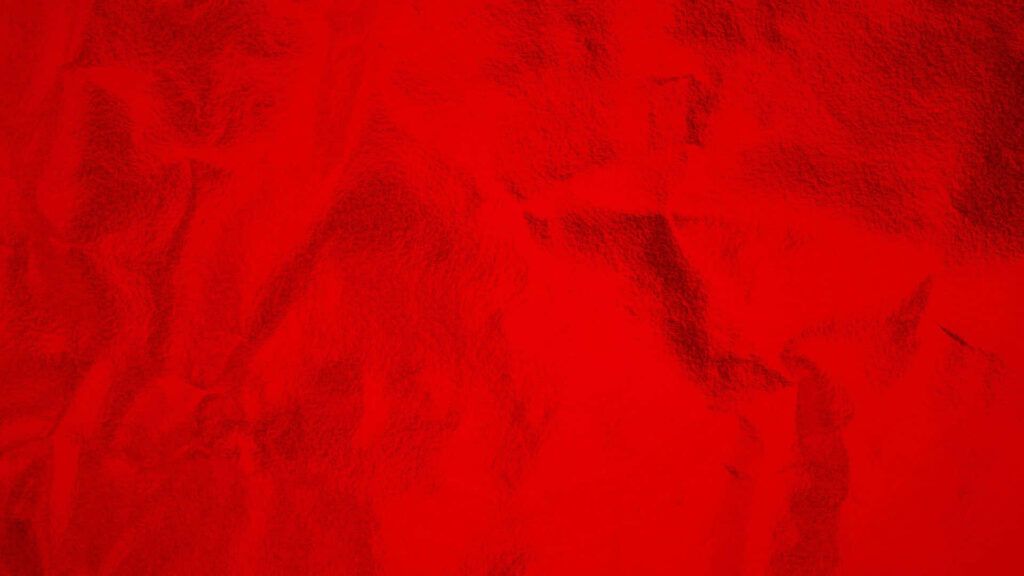 Vibrant Red Textured Wallpaper: Crumpled Fabric Design Background