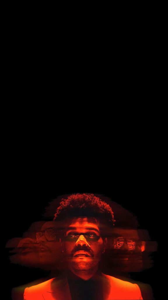 The Weeknd Wallpaper: Overlapping Faces in Vibrant Red Glow