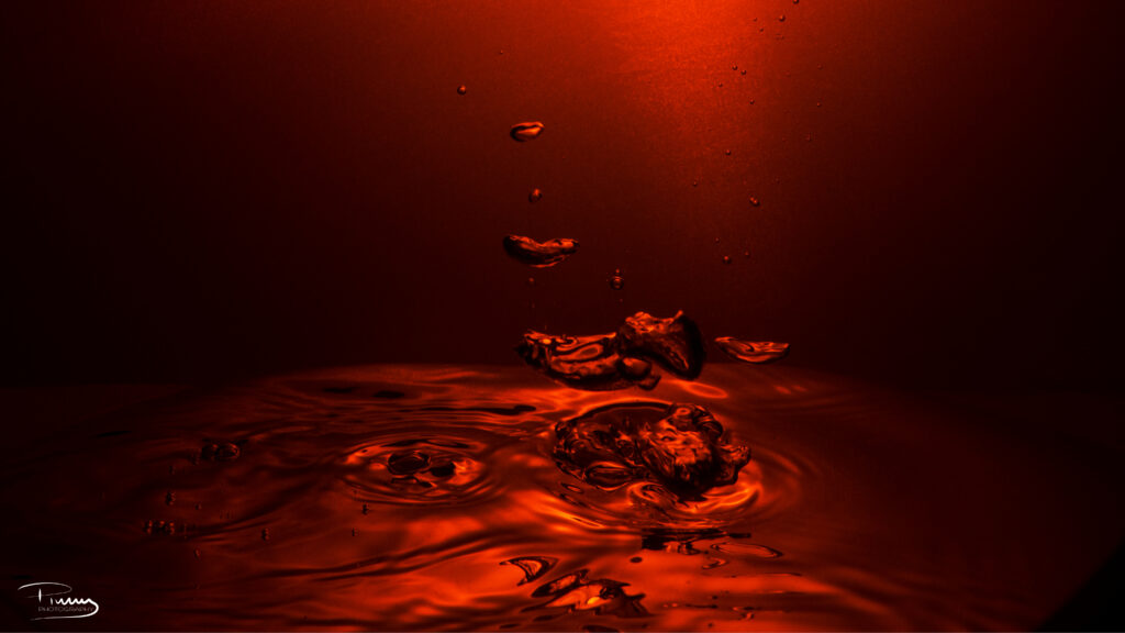 Vibrant Red Water Drops Ripple Wallpaper Background