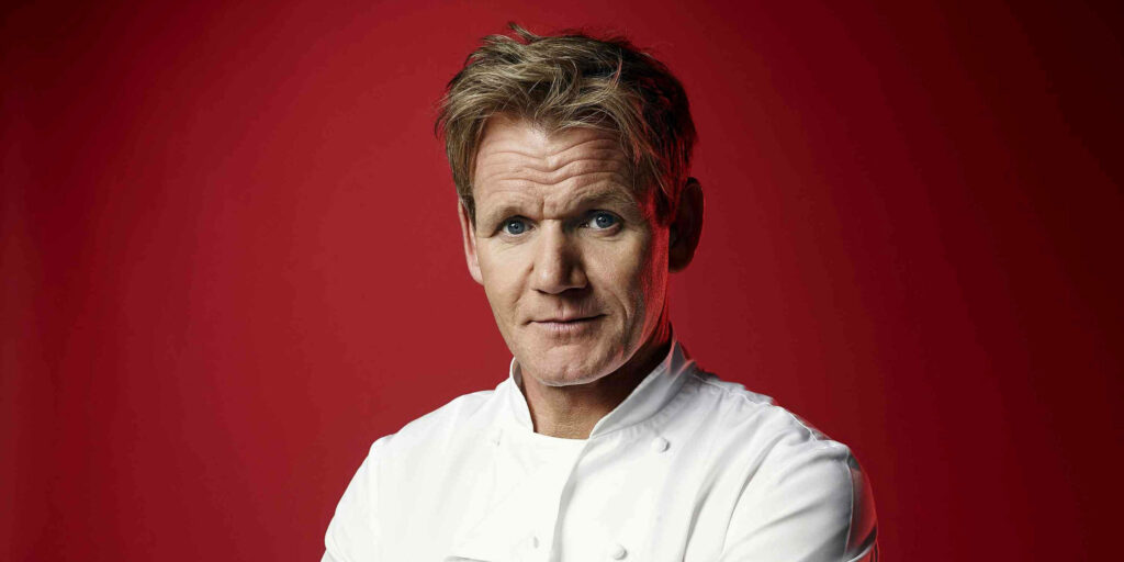 Vibrant Red Wallpaper of Gordon Ramsay in Iconic Chef Attire