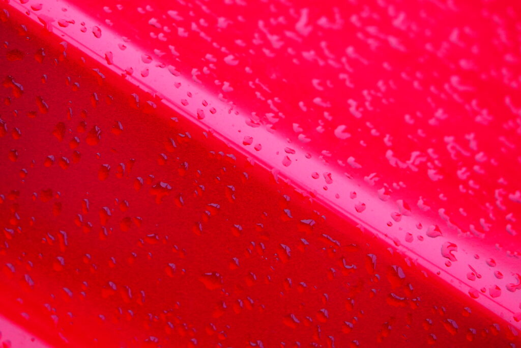 Vibrant Red Wallpaper: Macro Water Droplets on a Stunning Surface