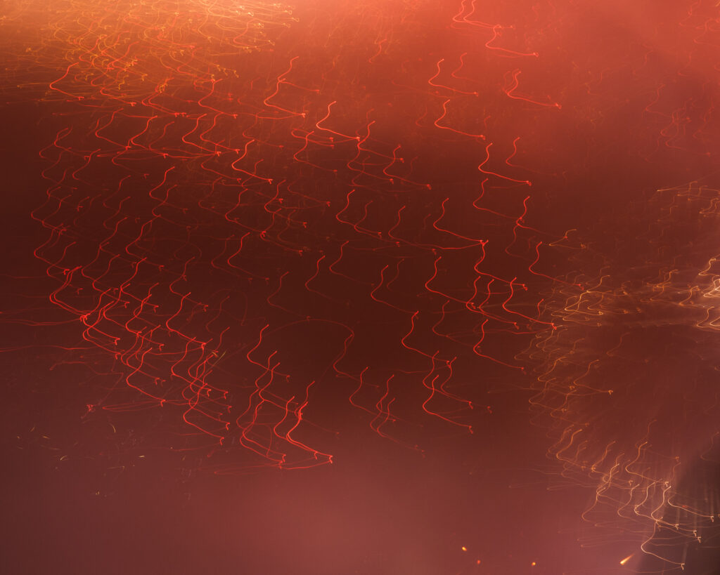 Vibrant Red Wavy Lines on Warm Background - Dynamic Wallpaper