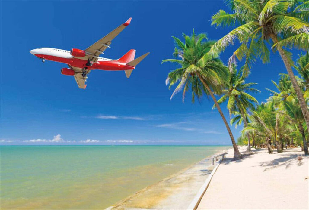 Red & White Airplane Over Tropical Beach - Vibrant Wallpaper