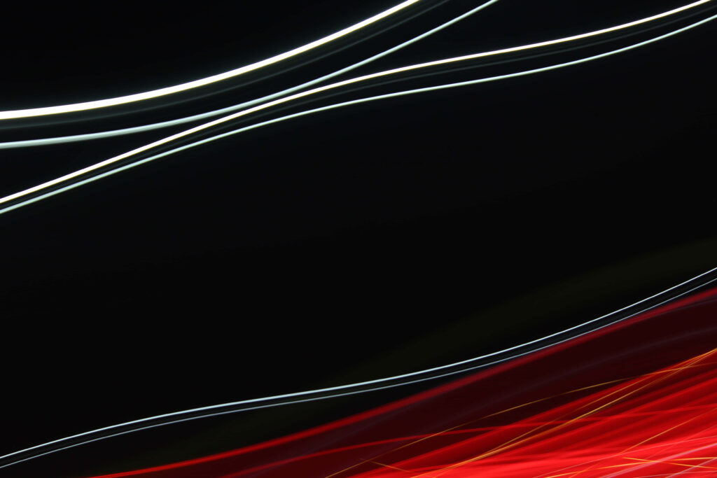 Vibrant Minimalistic Abstract Wallpaper: Flowing Red & Black Design
