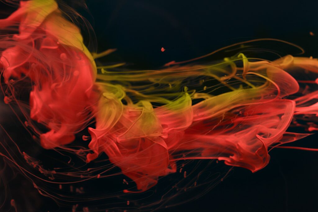 Vibrant Abstract Red and Yellow Ink Wallpaper Background Design