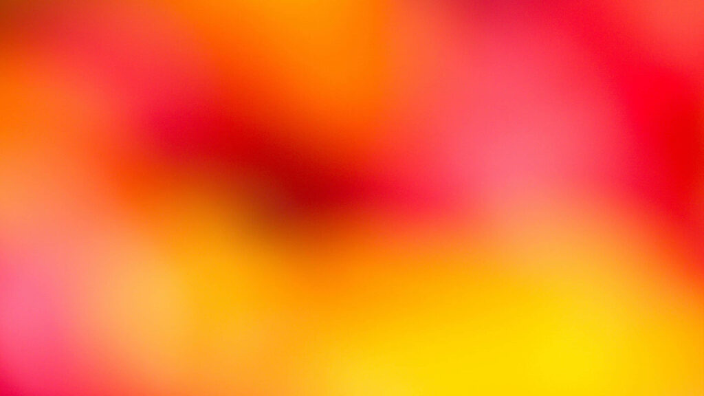 Vibrant Floral Wallpaper: Blurred Red & Yellow Petal Aesthetic