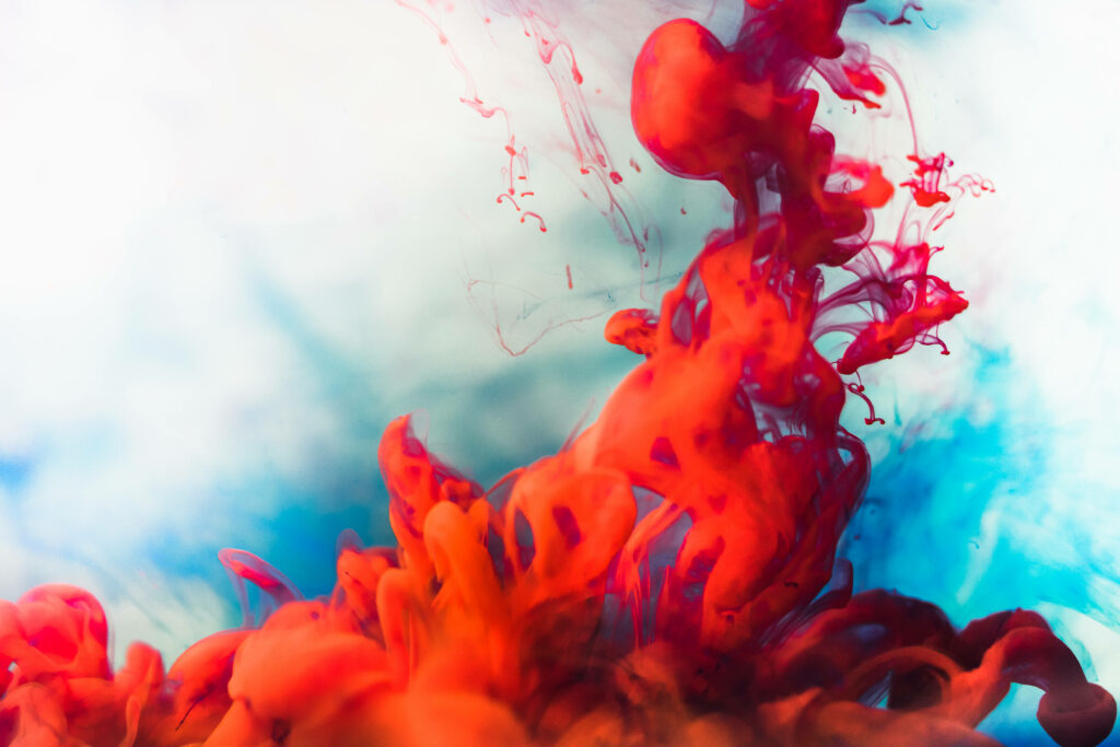 Vibrant Red Smoke & Blue Hues: Dynamic Abstract Wallpaper