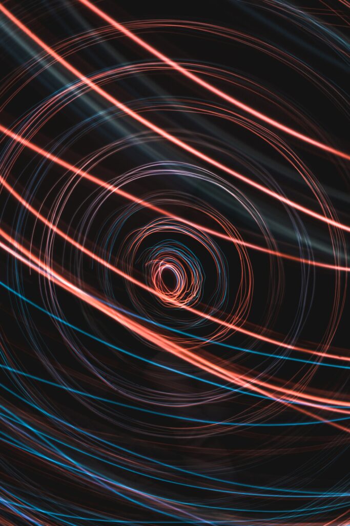 Dynamic Abstract Wallpaper: Mesmerizing Red & Blue Freezelight Design