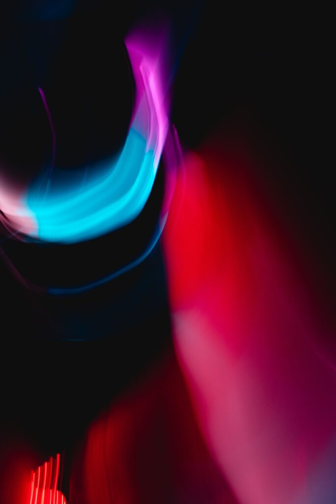 Dynamic Abstract Wallpaper: Vibrant Red & Blue on Dark Background