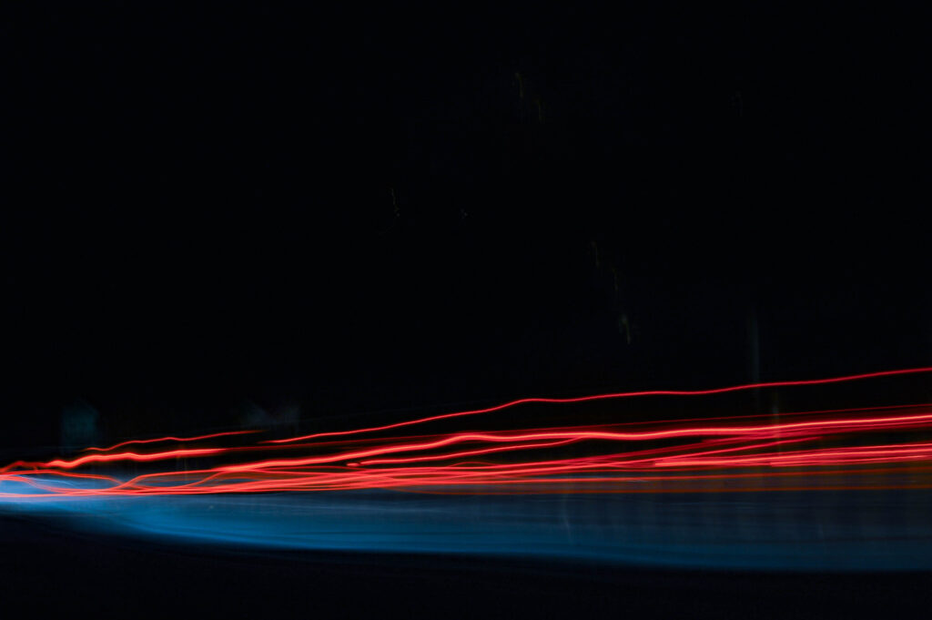 Dynamic Red & Blue Light Trails Wallpaper - 3008x2000 Resolution
