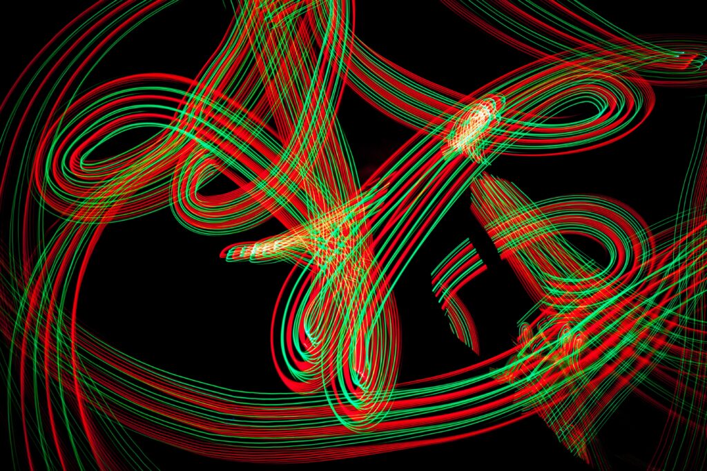 Vibrant Red & Green Line Patterns on Black Wallpaper Background
