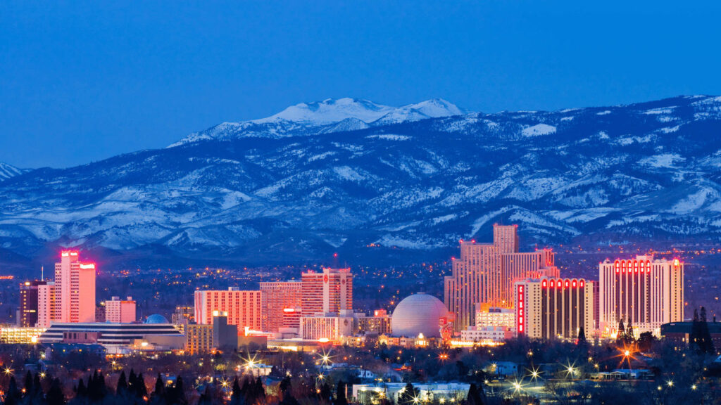 Reno Skyline Wallpaper: Vibrant City Lights & Snow-Capped Mountains
