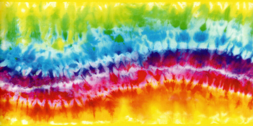 Vibrant tie-dye wallpaper with bold swirling layers of yellow green blue red and orange colors