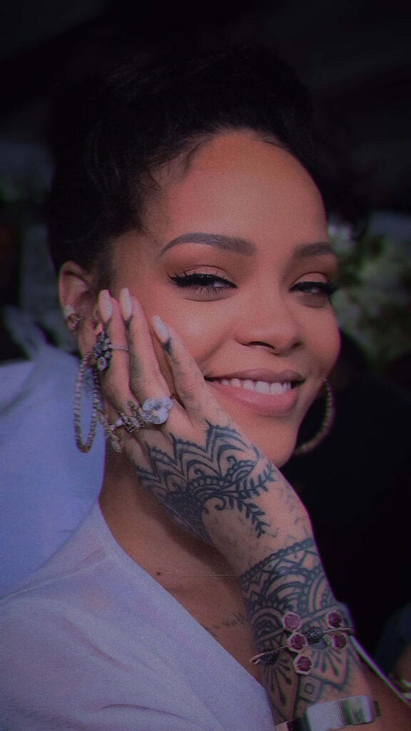 Vibrant Rihanna Wallpaper: Confidence & Style with Hand Tattoos
