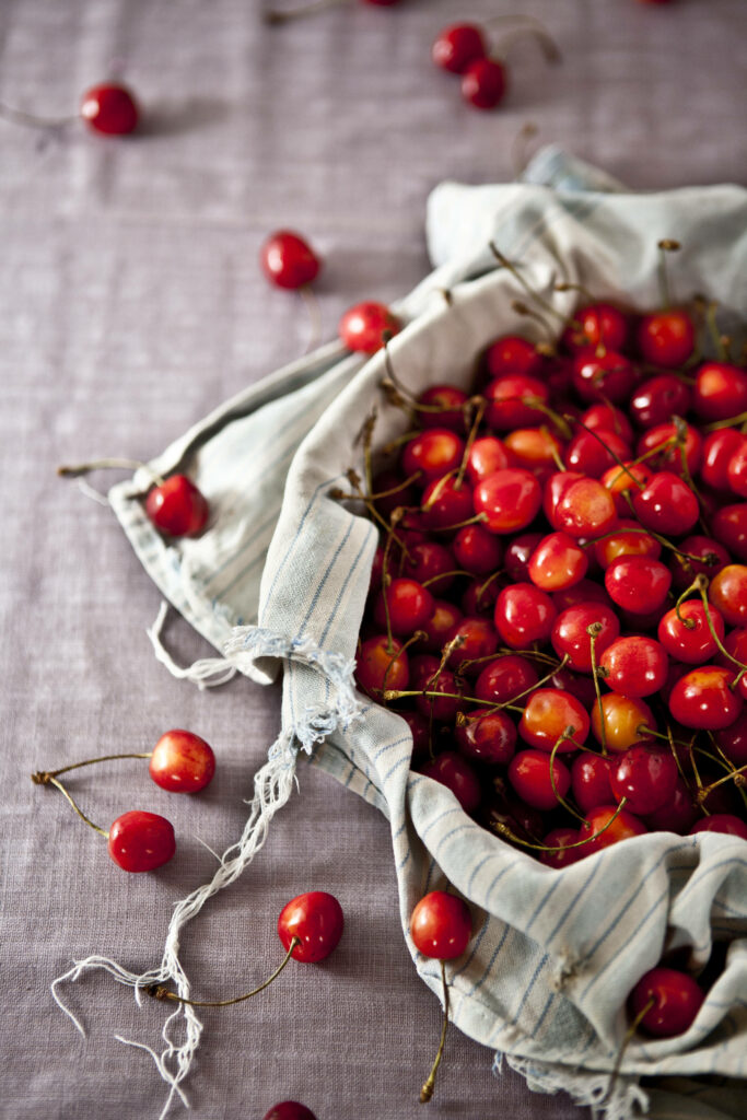 Fresh Ripe Cherries in Rustic Burlap | Summer Wallpaper Background