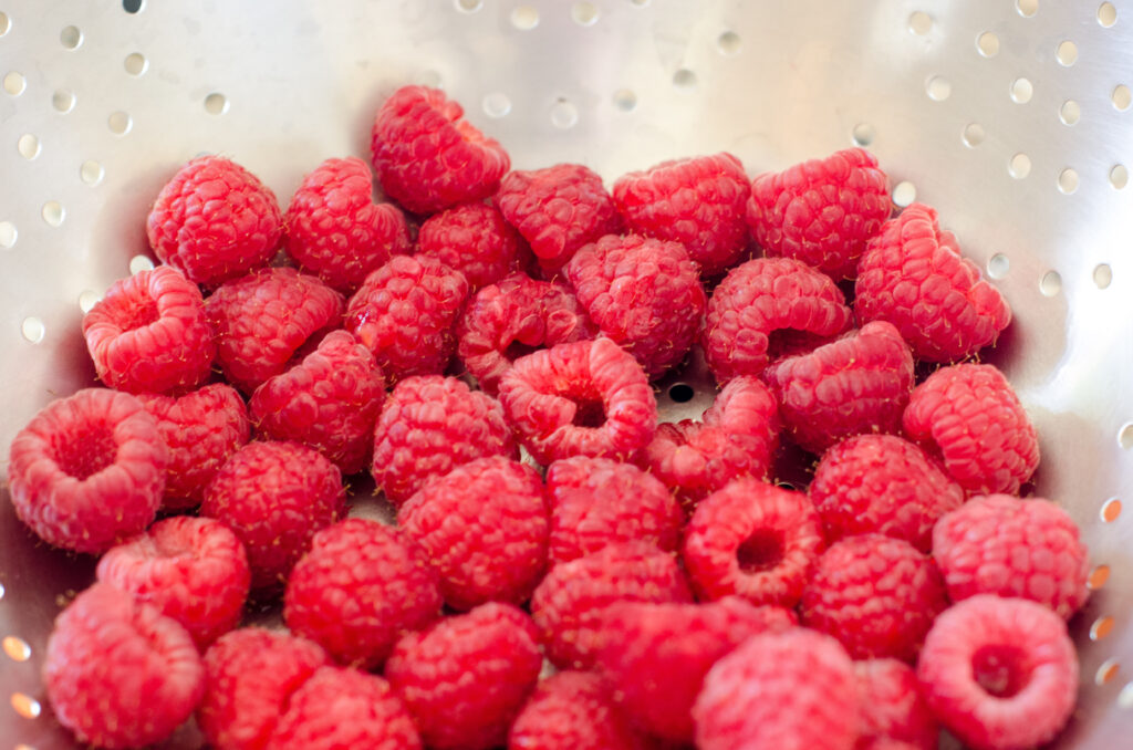 Macro Wallpaper of Ripe Red Raspberries - Fresh Texture Background