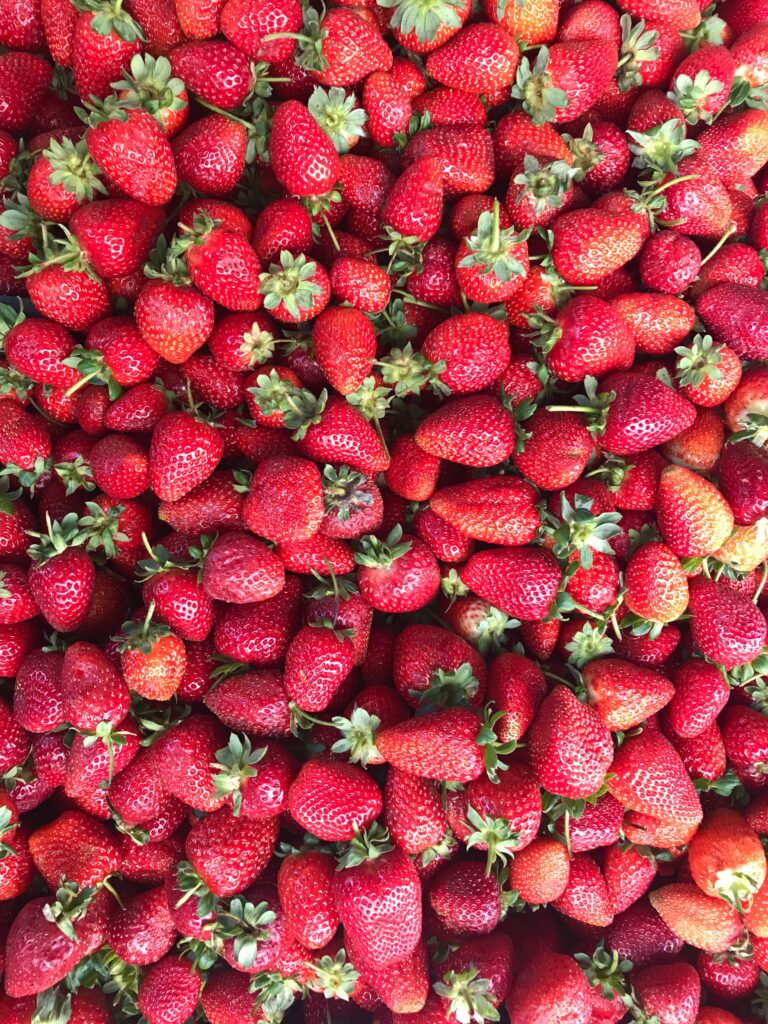 Vibrant Ripe Red Strawberries Wallpaper Background - Fresh & Juicy