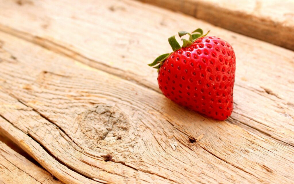 Juicy Ripe Strawberry on Rustic Wood - Fresh Wallpaper Background