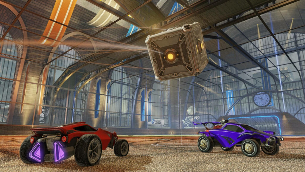 Rocket League Rivalry: Clash of the Cars in Pursuit of the Square Ball Wallpaper