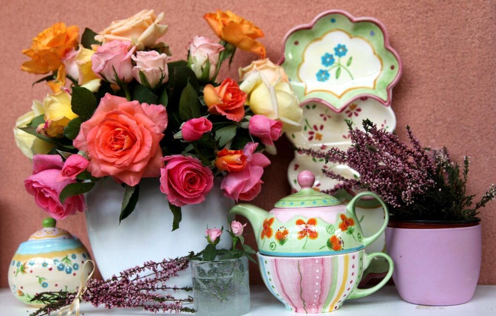 Vibrant Roses in White Vase: Cozy Floral Decor Wallpaper
