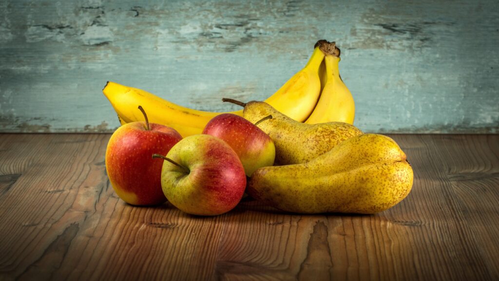 Rustic Fruit Wallpaper: Fresh Apples, Bananas & Pears on Wood