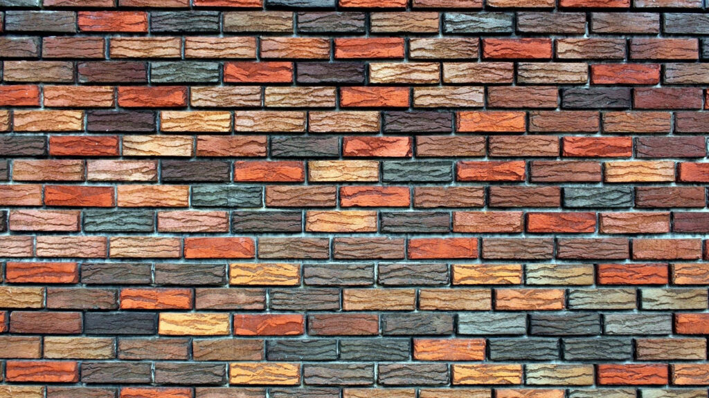 Vibrant Rugged Brick Wallpaper: Rustic Red, Orange, and Gray Design