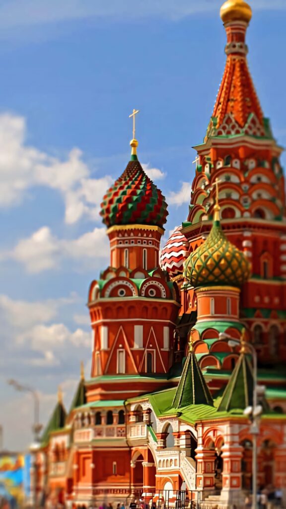 Vibrant portrait wallpaper of Saint Basils Cathedral Kremlin Moscow colorful domes blue sky