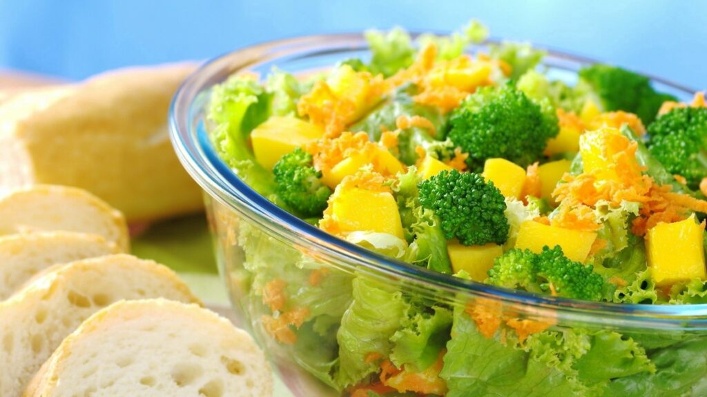 Vibrant Salad Bowl with Broccoli, Mango & Carrots - Wallpaper Background