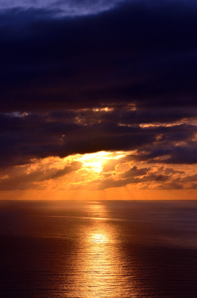 Vibrant Santa Catarina Brazil sunset over ocean golden sunlight reflects on calm water wallpaper