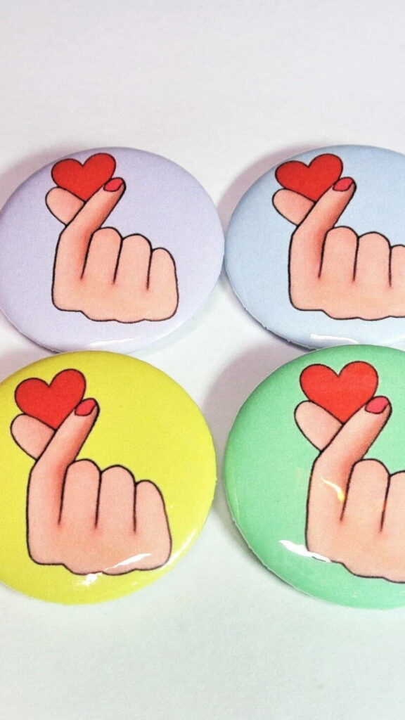Vibrant Saranghae Finger Heart Pins Wallpaper: Love & Affection