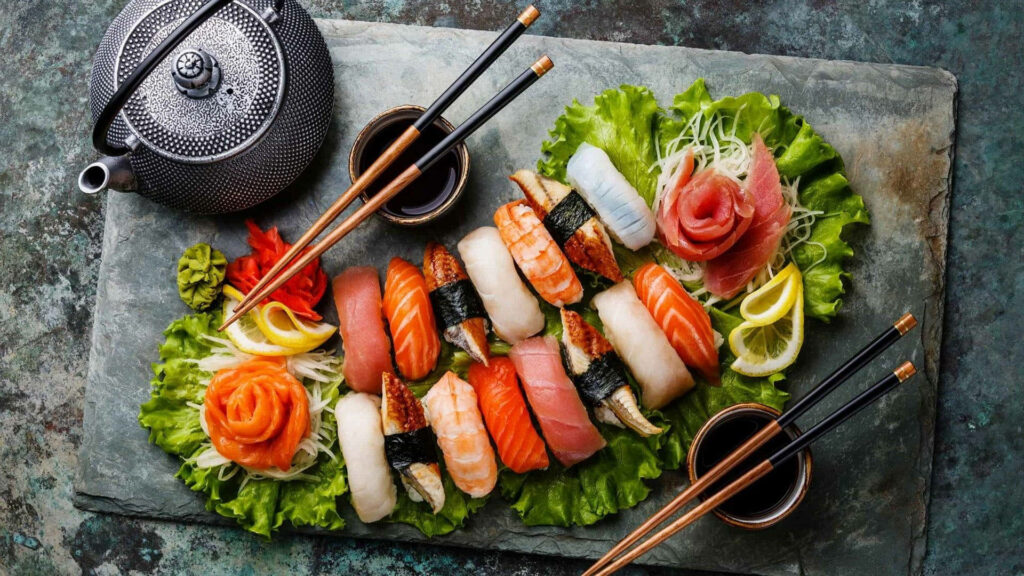Vibrant Sashimi Meal Wallpaper: Fresh Seafood on Lettuce Leaves