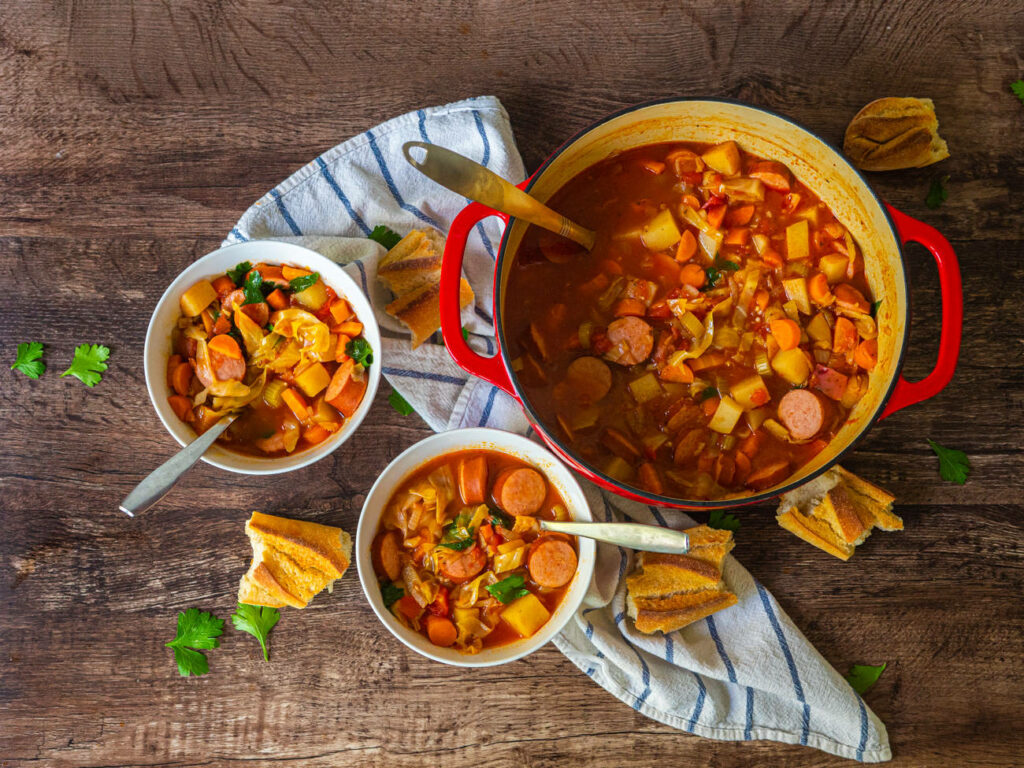 Vibrant Saucy Sausage Rougali Soup Wallpaper with Rustic Charm
