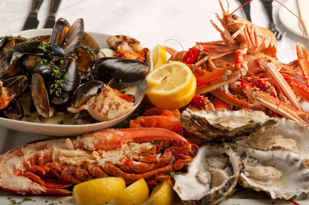 Vibrant Seafood Platter: Fresh Shellfish Wallpaper Background