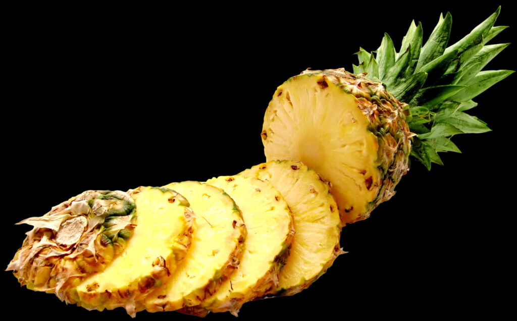 Vibrant Sliced Pineapple Wallpaper: Yellow Flesh on Black Background
